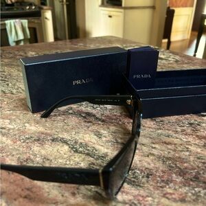 Prada Sunglasses! Barley used comes with case and pamphlet.